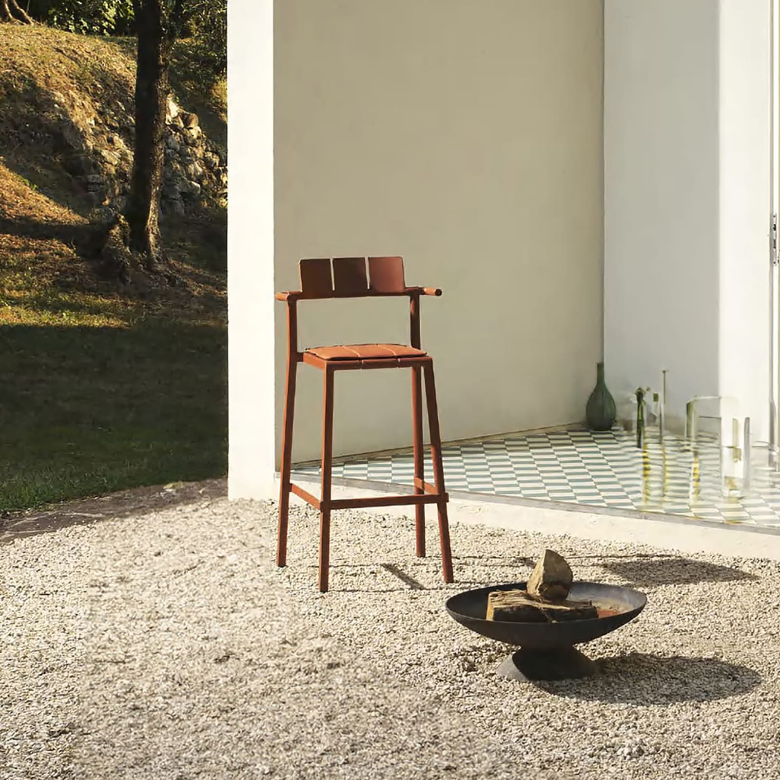 Stackable Yard counter stool with arms by TOOU Design, perfect for kitchen counters, patios, or cafe settings.